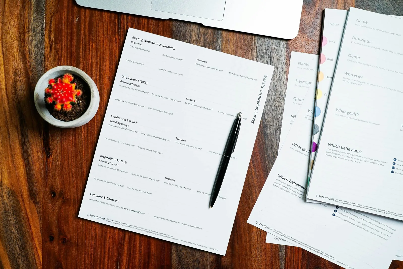 Forms and a pen on a desk
