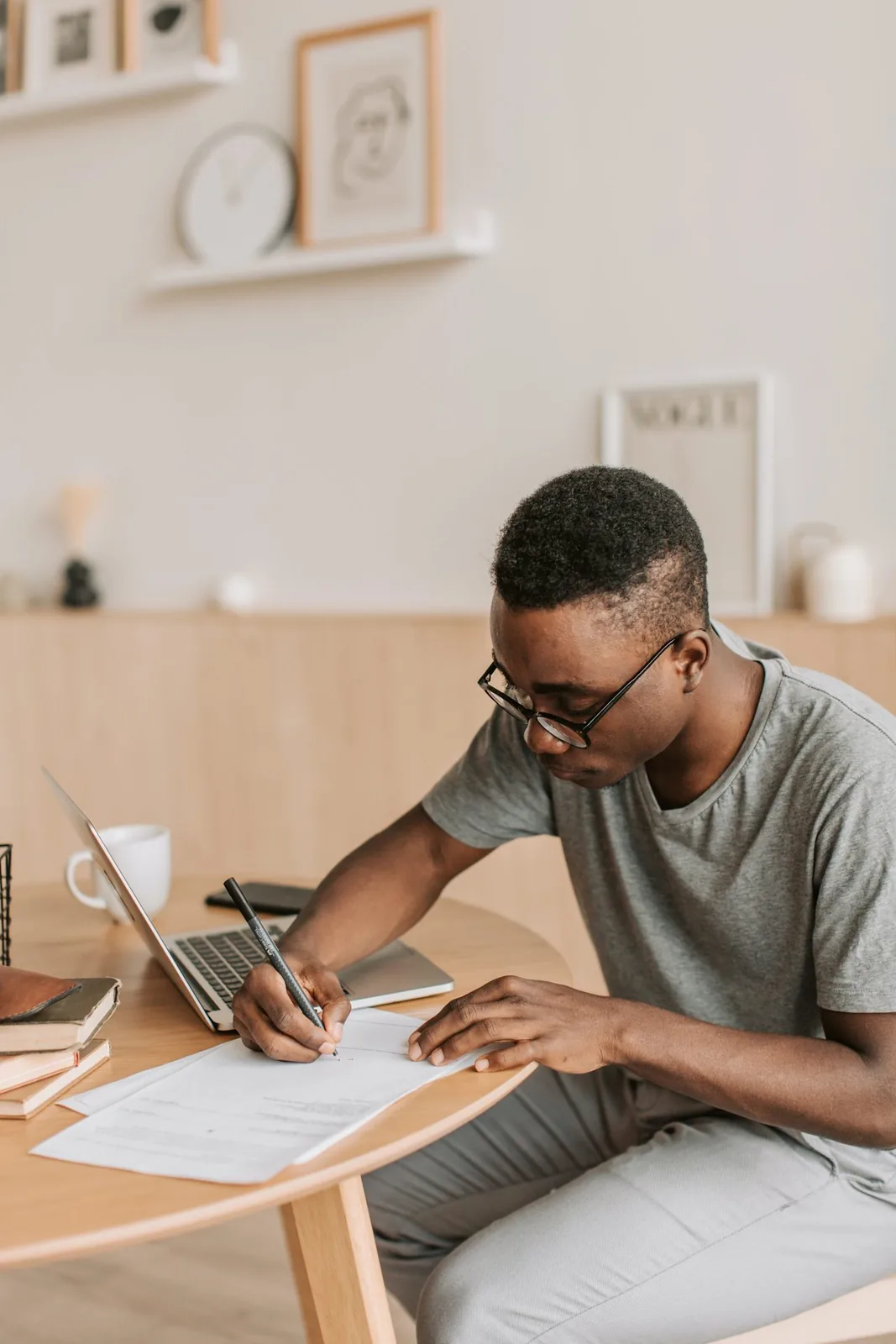 Man completing a form at home