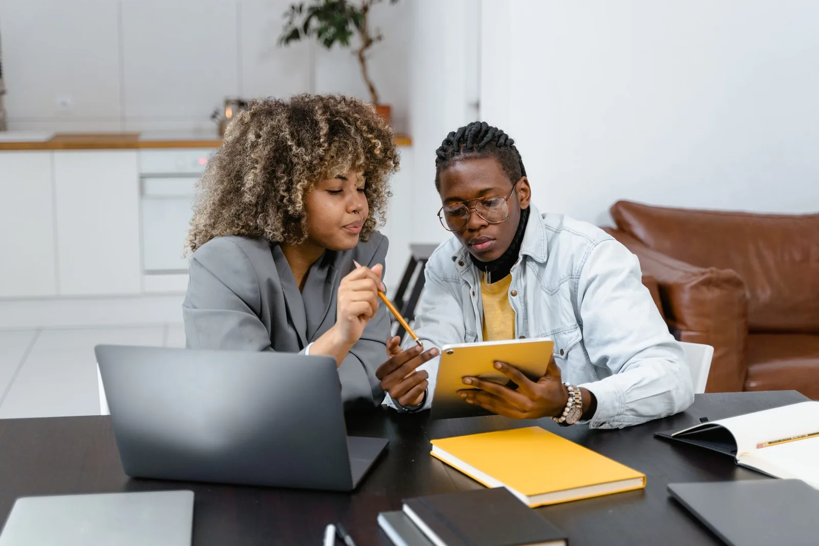 Two people reviewing a document together