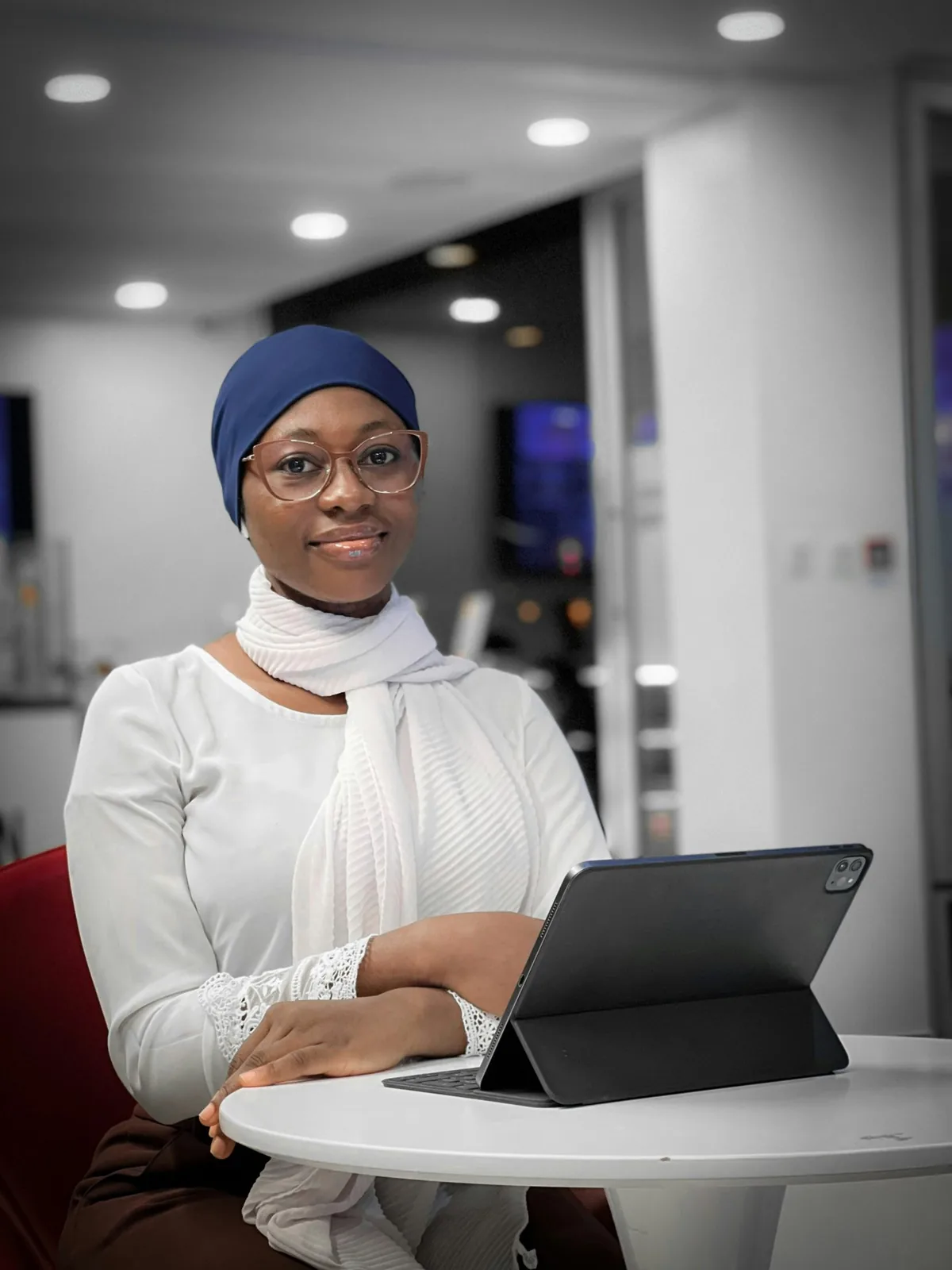 Smiling consultant holding a tablet in a bright office
