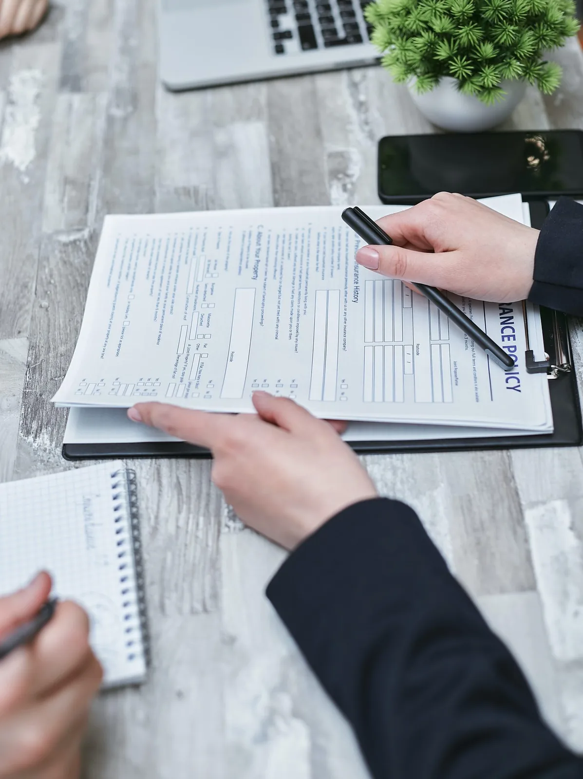 Two people reviewing a form together